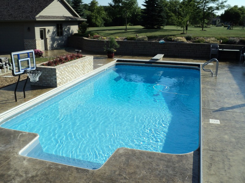 Landscaping and in-ground pool installed by Spring's Pools and Spas